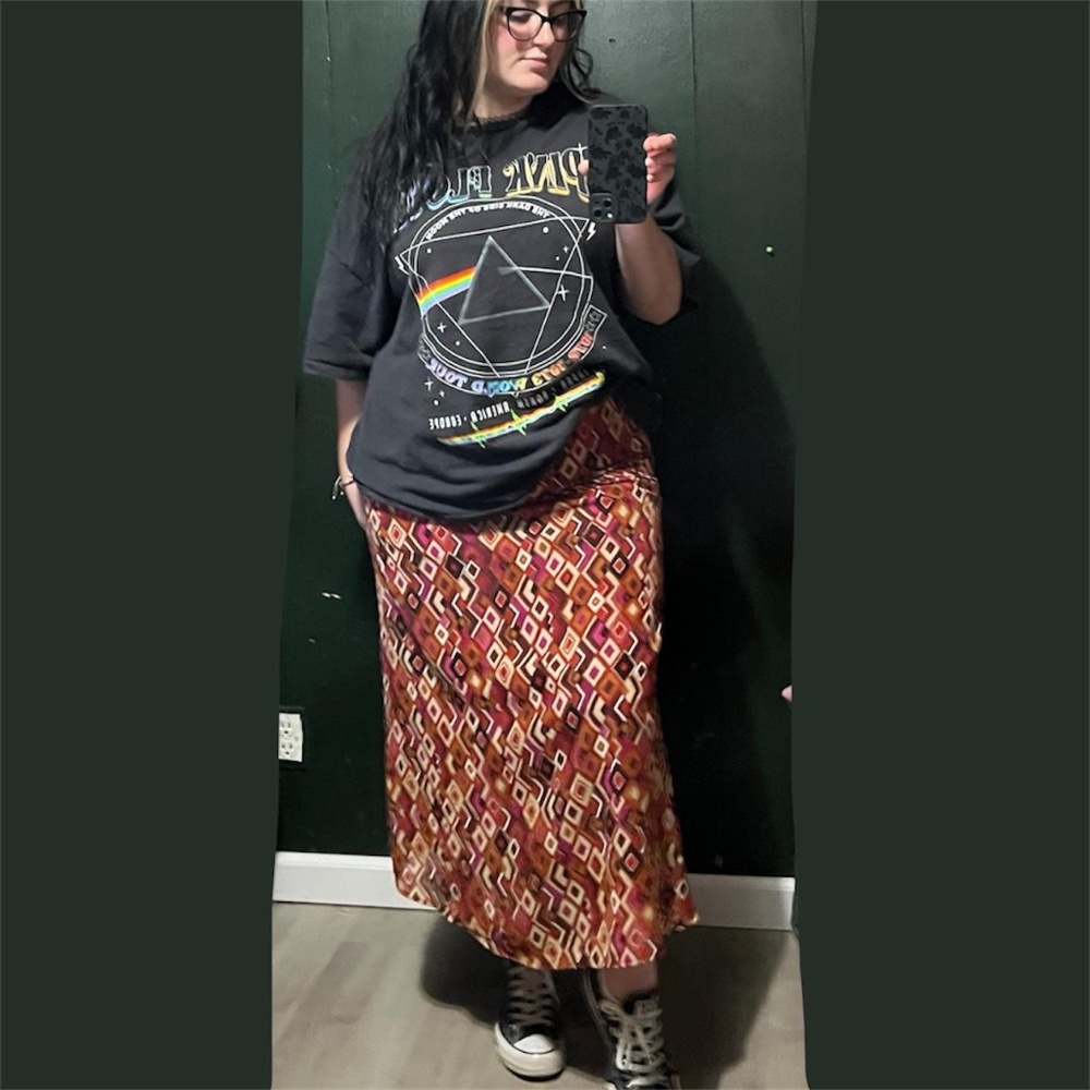 Groovy orange and pink geometric pattern midi skirt with a retro vibe